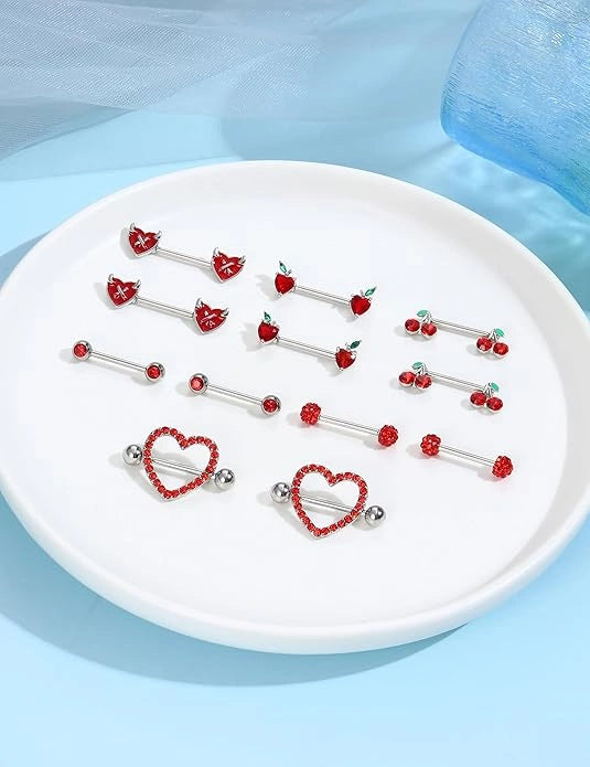 red 14G stainless steel heart nipple rings barbell close-up