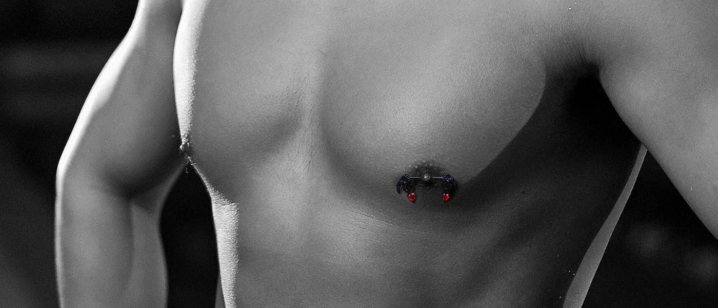 A photo of a model showcasing nipple ring piercings.